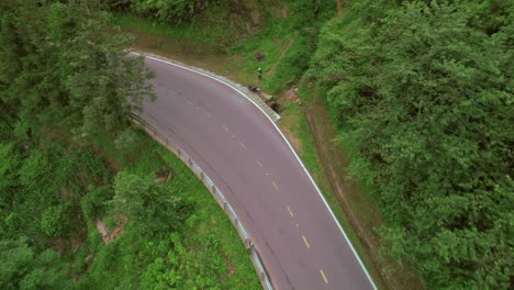 drone flighting over a curved road in sa pa, vietnam