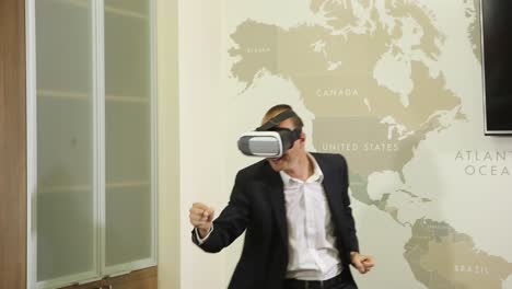 business man using vr glasses. good looking business manager relaxing at a room and using vr glasses