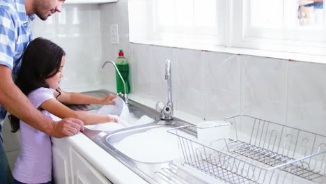 Father-and-daughter-doing-the-dishes