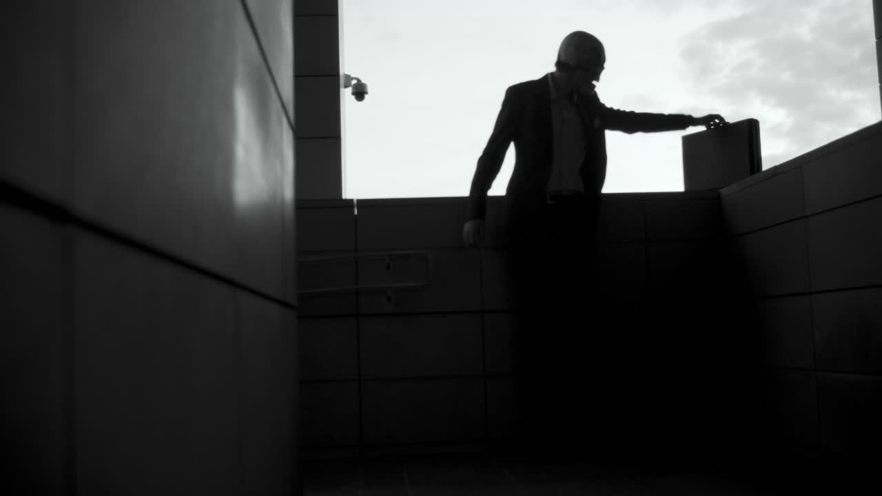 Businessman Waiting on Balcony