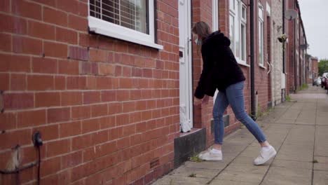 girl safely dropping off a care package to grandparent's house | full shot