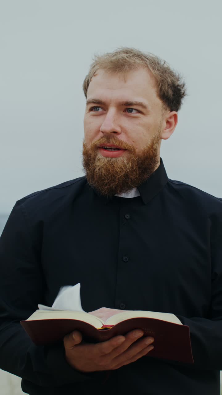 Man Reading a Book Outdoors