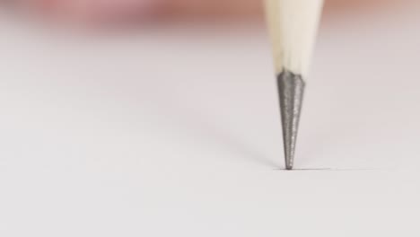 finger picks up a small coin from the pile.