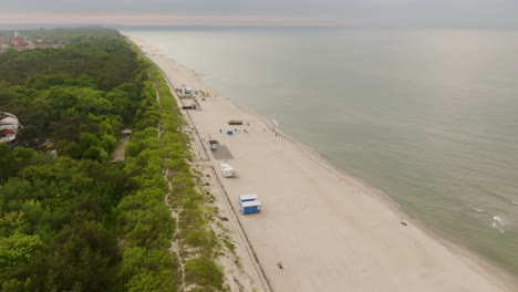 aerial view rotating over a beach at the hel peninsula, summer evening in poland