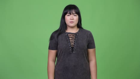 beautiful overweight asian woman giving handshake