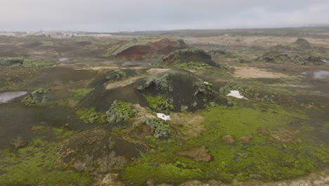 Aerial-panoramic-view-of-Raudholar-craters,-the-Red-Hills,-geological-formations-of-volcanic-rocks,-in-Iceland