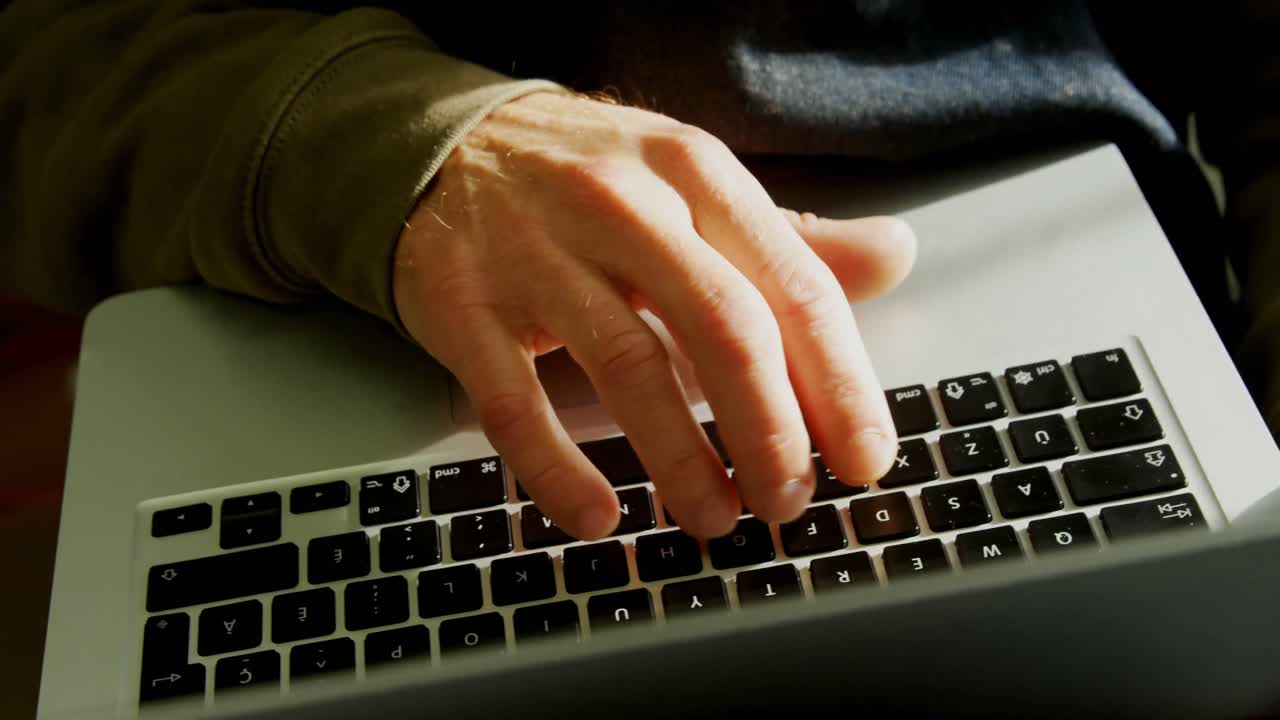 Craftsman using laptop in workshop 4k