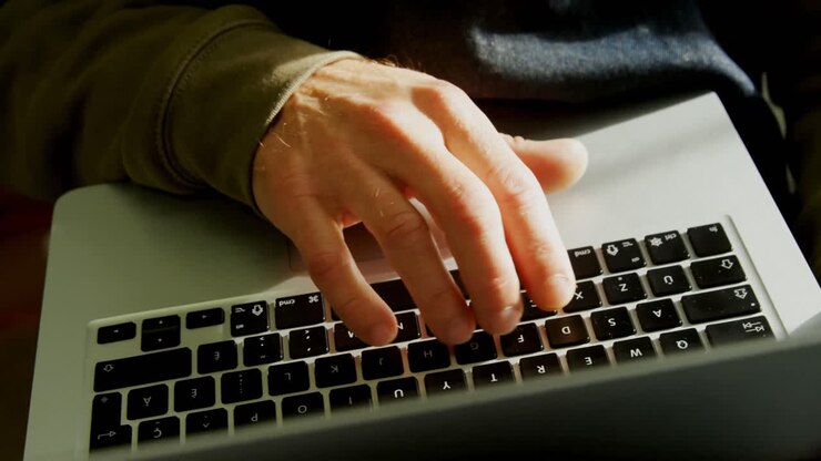 Craftsman using laptop in workshop 4k