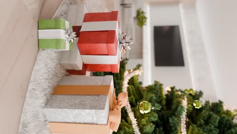 wrapped gifts under a decorated christmas tree in a cozy living room