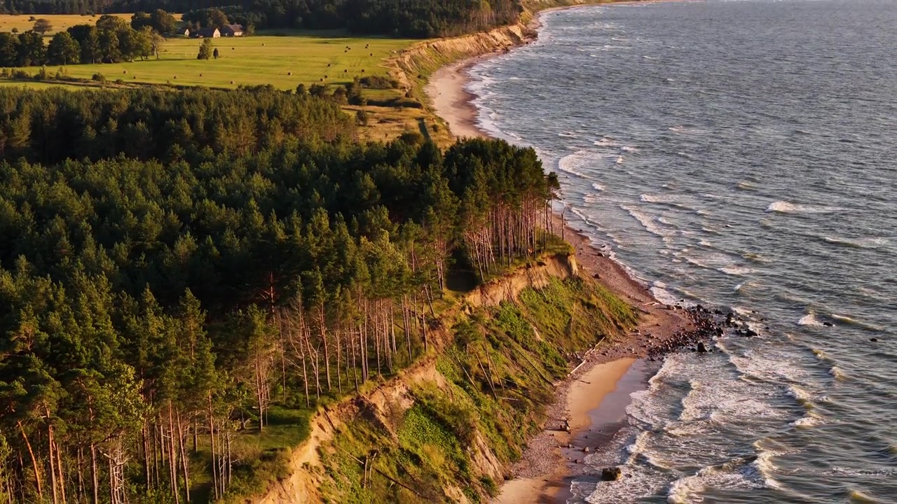 Breathtaking coastal cliffs of Baltic sea at Jurkalne, Latvia at sunset, aerial