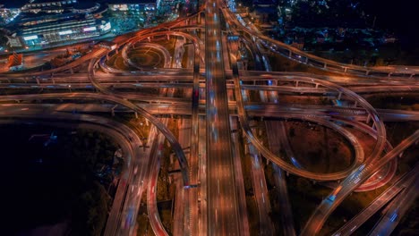 aerial hyperlapse of traffic over big intersection bridges and ring road. 4k aerial view by a drone over big roundabout in bangkok thailand.