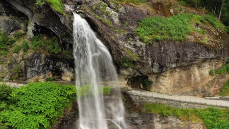 Steinsdalsfossen-is-a-waterfall-in-the-village-of-Steine-in-the-municipality-of-Kvam-in-Hordaland-county,-Norway.-The-waterfall-is-one-of-the-most-visited-tourist-sites-in-Norway.