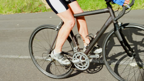 senior cyclist cycling on a road 4k