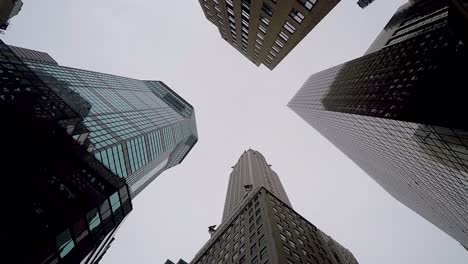 looking up to symbol of capitalism the high towers of new york city