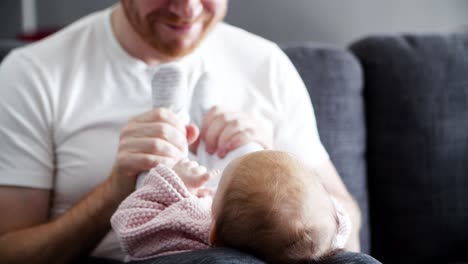 Funny-dad-playing-with-baby-daughter