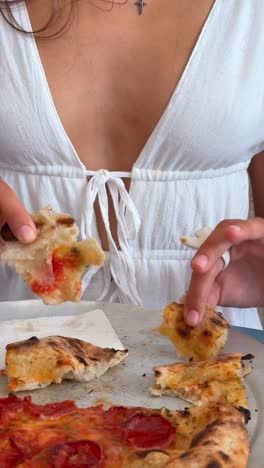 woman enjoying a delicious pizza