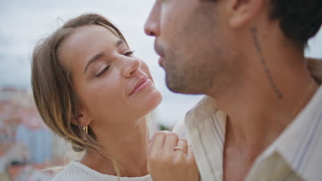 sensual woman caressing man face at city date closeup. romantic love moments