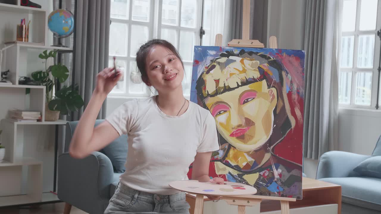 Young Artist Displaying Her Painting