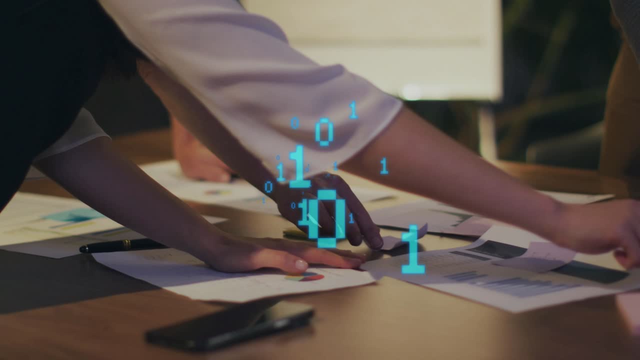 Woman placing hands on charts causing organizing business data and noting data with binary overlay