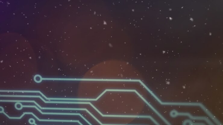 Animation of white specks floating over computer circuit board