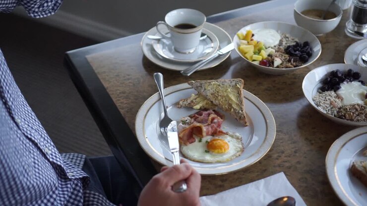 SLOWMO - Young couple having healthy breakfast at a luxury resort