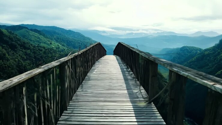 Wooden bridge over a mountain landscape