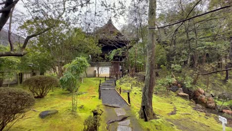 pathway to entrance of konchi-in buddhist temple on rainy day in kyoto, japan