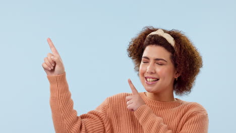 Face,-hand-pointing-and-happy-woman-in-studio