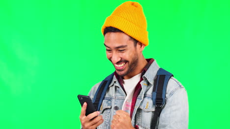 Young-man,-phone-and-celebration-by-green-screen