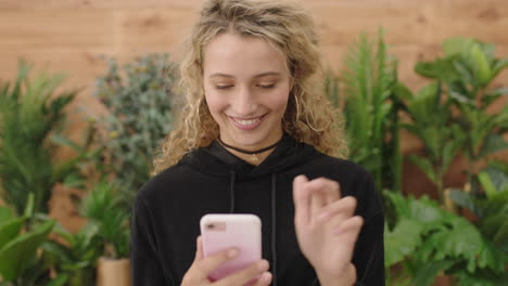 portrait-of-attractive-young-blonde-woman-smiling-browsing-online-shopping-using-smartphone-app-technology-enjoying-mobile-communication