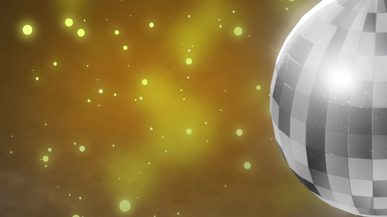 Animation af spejldiskokugle, der drejer rundt over lyspletter på gul baggrund