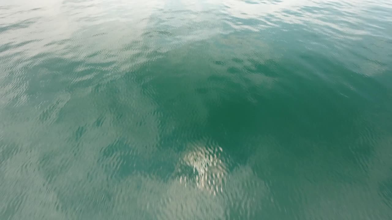 Aerial drone shot flying over mediterranean sea in South of France. low altitude