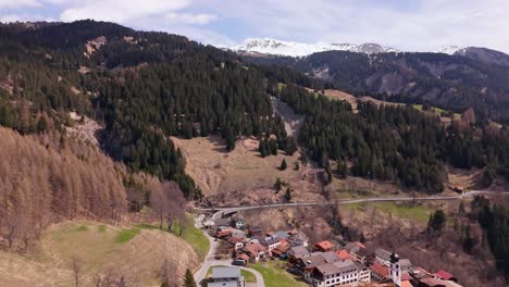 aerial shot of peist, switzerland with a mountainous landscape and village view