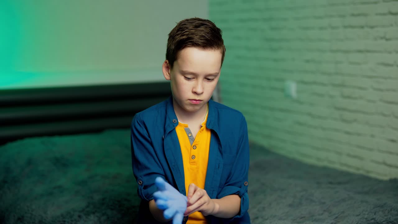 Boy wearing a protection gloves. Environmental and health concept. Protection against covid 19.