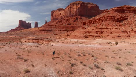 girl taking pictures of monument valley, in utah