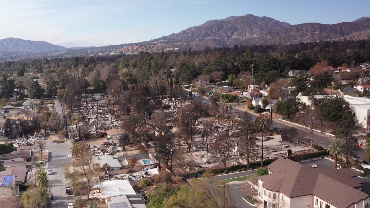 Low aerial shot flying along Altadena Drive in the aftermath of the devastating Eaton Fire in Southern California. 4K