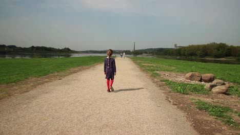 Child-Lady-And-Confluence-Of-Rivers-in-Kaunas,-Lithuania-1