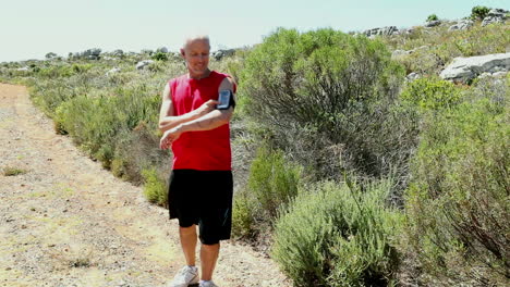 man jogging through a wild terrain