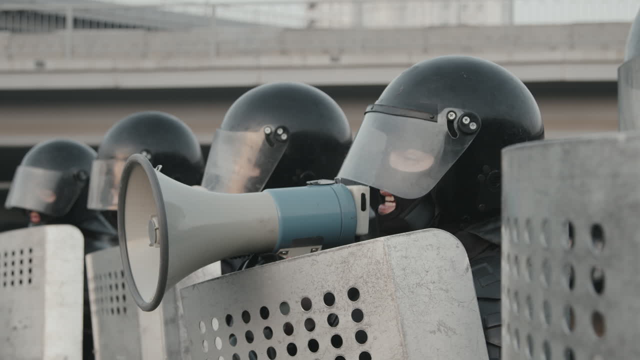 Riot Police Line with Megaphone