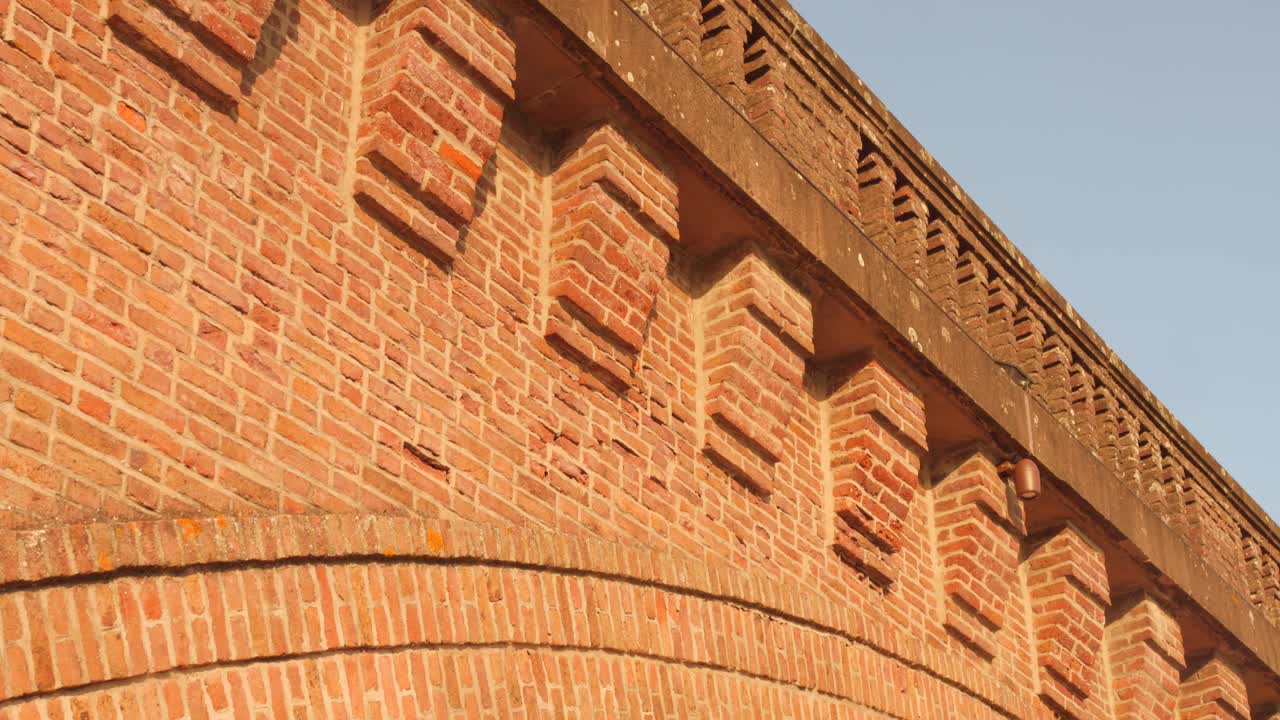 Closeup view of brick architecture Albi railway bridge during noon in France. Red bricks