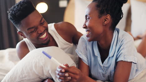 Happy-couple,-embrace-and-pregnancy-test-with-news