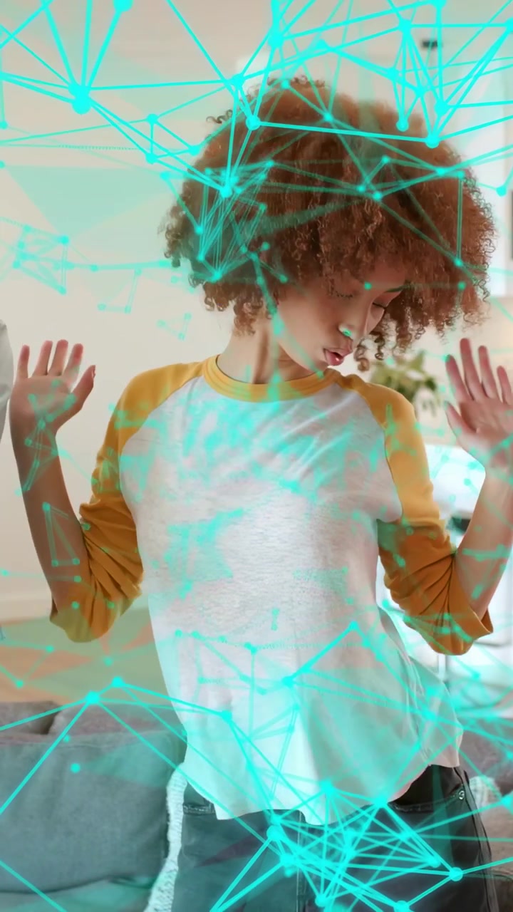 Vertical video: Woman dancing in home, pal arm urging synced moves while cyan tech overlaying