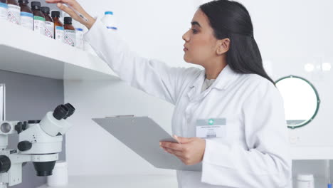 medical researcher checking pharmaceutical sample