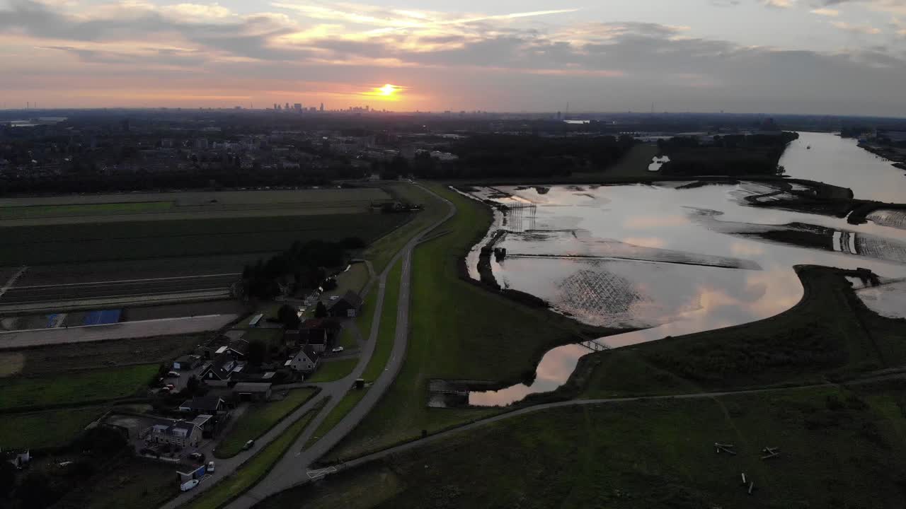 Aerial View of River and Cityscape at Sunset
