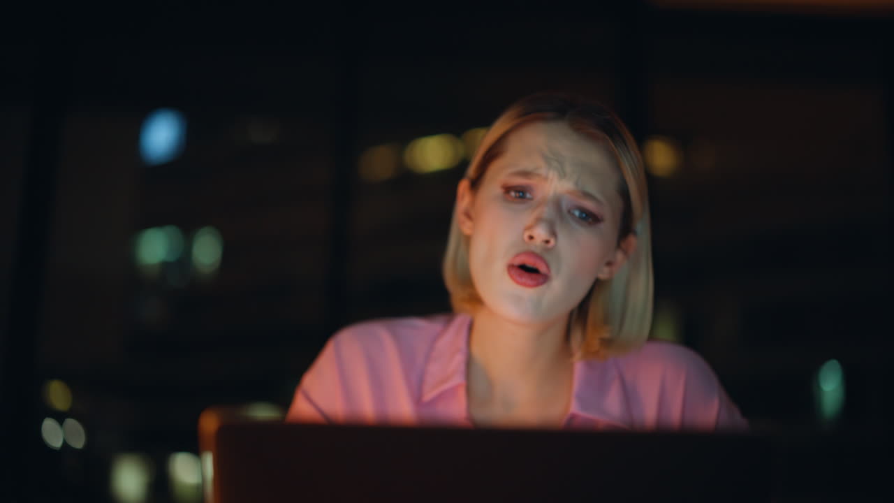 Emotional Woman Working Late at Computer