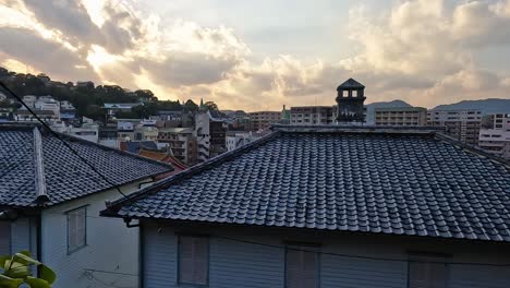 View-over-tiles-and-roof-onto-the-city-of-Nagsaki,-Japan