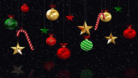 Animation-of-christmas-decorations-over-snow-on-black-background