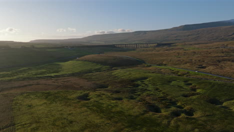 establishing aerial drone shot of yorkshire dales and ribblehead viaduct