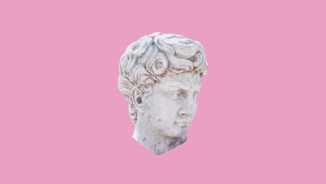 animación de formas de color sobre la escultura de la cabeza sobre un fondo rosado