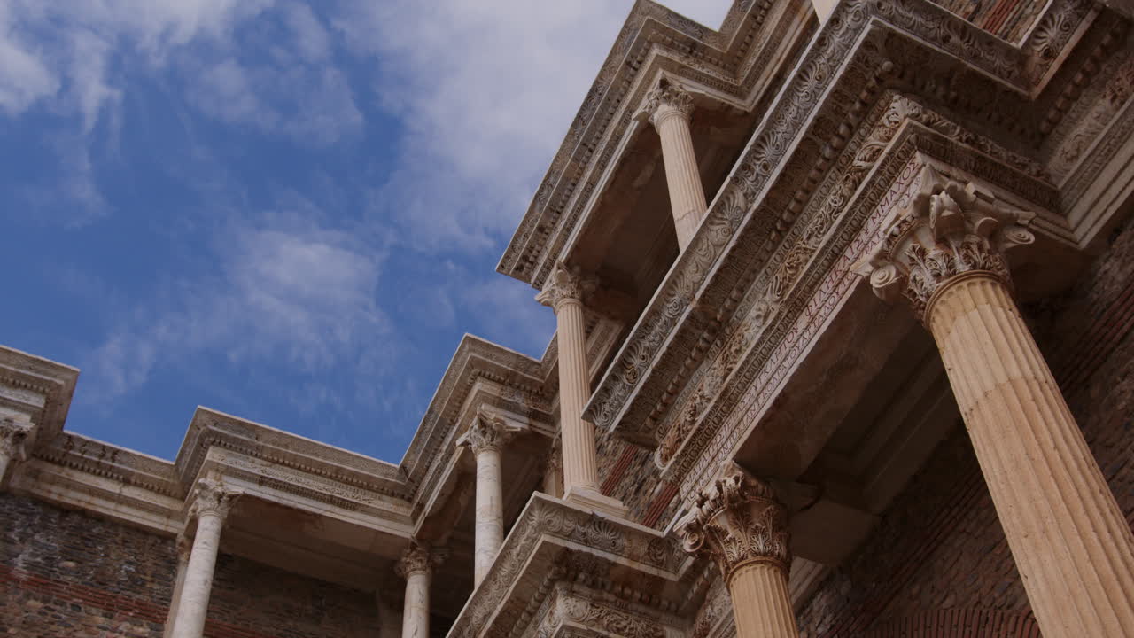 Looking up at pillars of the ancient Gymnasium and clouds in Sardis